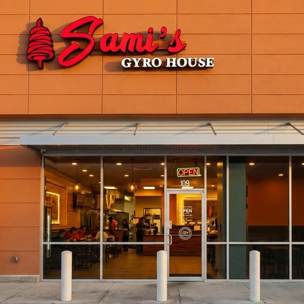 Exterior of Sami's Gyro House with a red sign and large glass windows showing the interior.