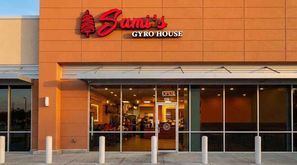 Exterior of Sami's Gyro House with a red sign and large glass windows showing the interior.